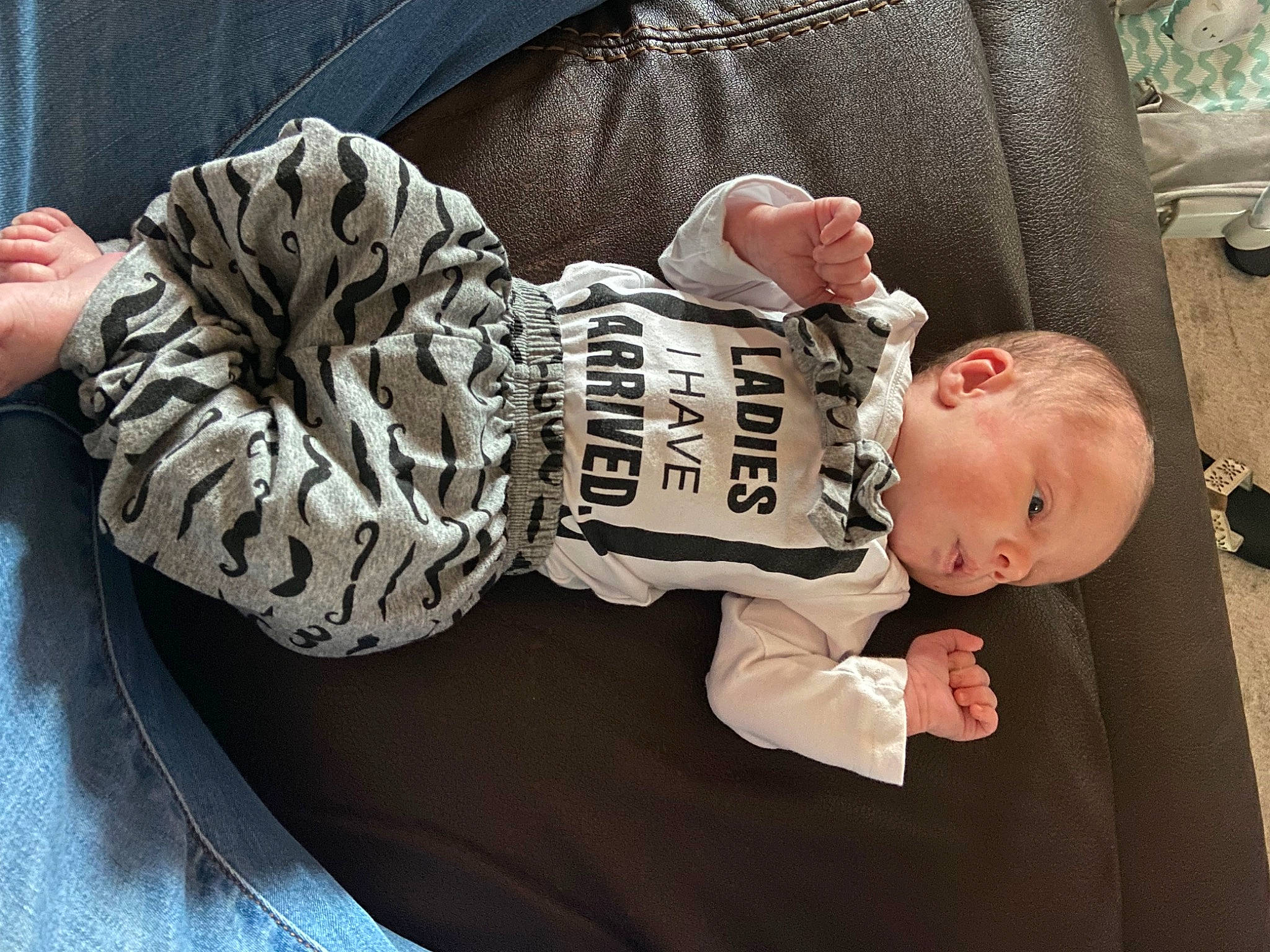 Bradley is registered to the contest to win money with this photo: baby, baby_products, baby_safety, baby_toddler_clothing, child, comfort, elbow, fashion_accessory, fashion_design, fur, hairstyle, human_body, linens, mouth, pattern, person, room, sitting, sleeve, toddler