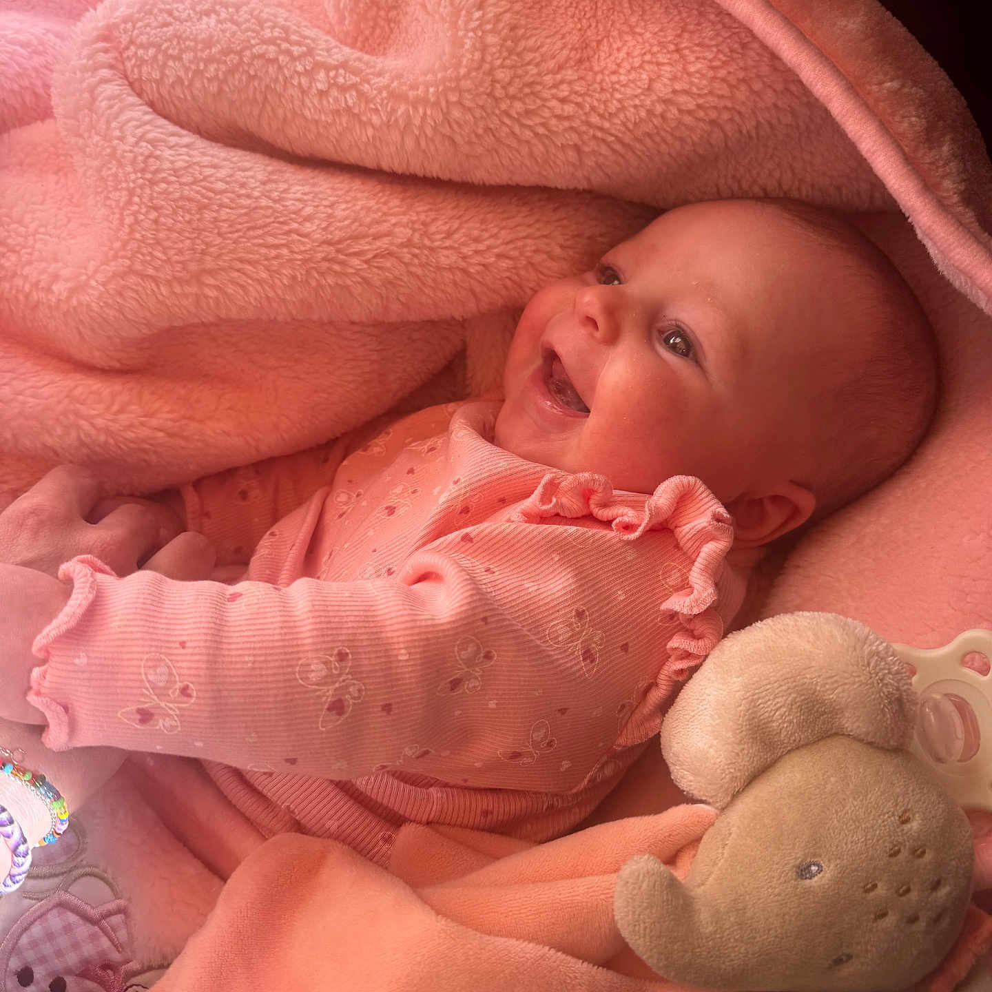 Maïlee participe au concours pour gagner de l'argent avec cette photo : baby, smiling, pink_blanket, plush_toy, elephant_toy, infant, cute, cozy, soft_texture, child, wrapped, happy, clothing, holding_hands, portrait, indoors, newborn, warm_light, sleepwear, peaceful