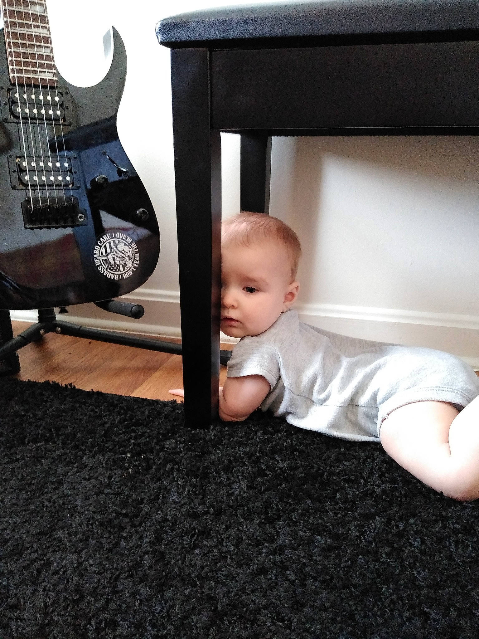 Suzanna is registered to the contest to win money with this photo: baby, child, floor, flooring, furniture, person, play, sitting, toddler, wood