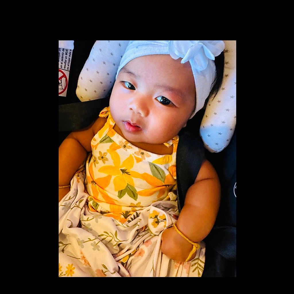 Mila-Juliette is registered to the contest to win money with this photo: baby, bonnet, cap, clothing, couch, cushion, dress, face, flag, furniture, happy, hat, head, homedecor, people, person, photography, portrait, sitting, smile