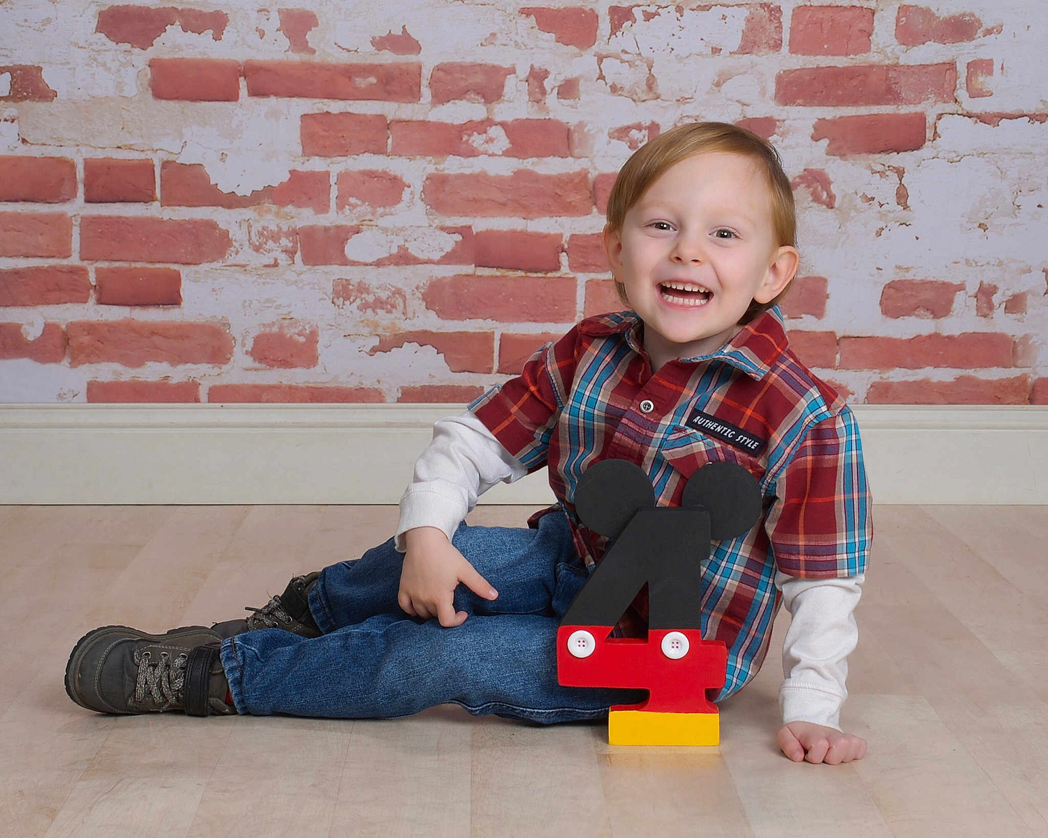 William joined the competition — help win amazing prizes! brick, child, child_model, design, floor, flooring, joy, pattern, person, plaid, play, red, sitting, sleeve, smile, tartan, toddler, toy, wall