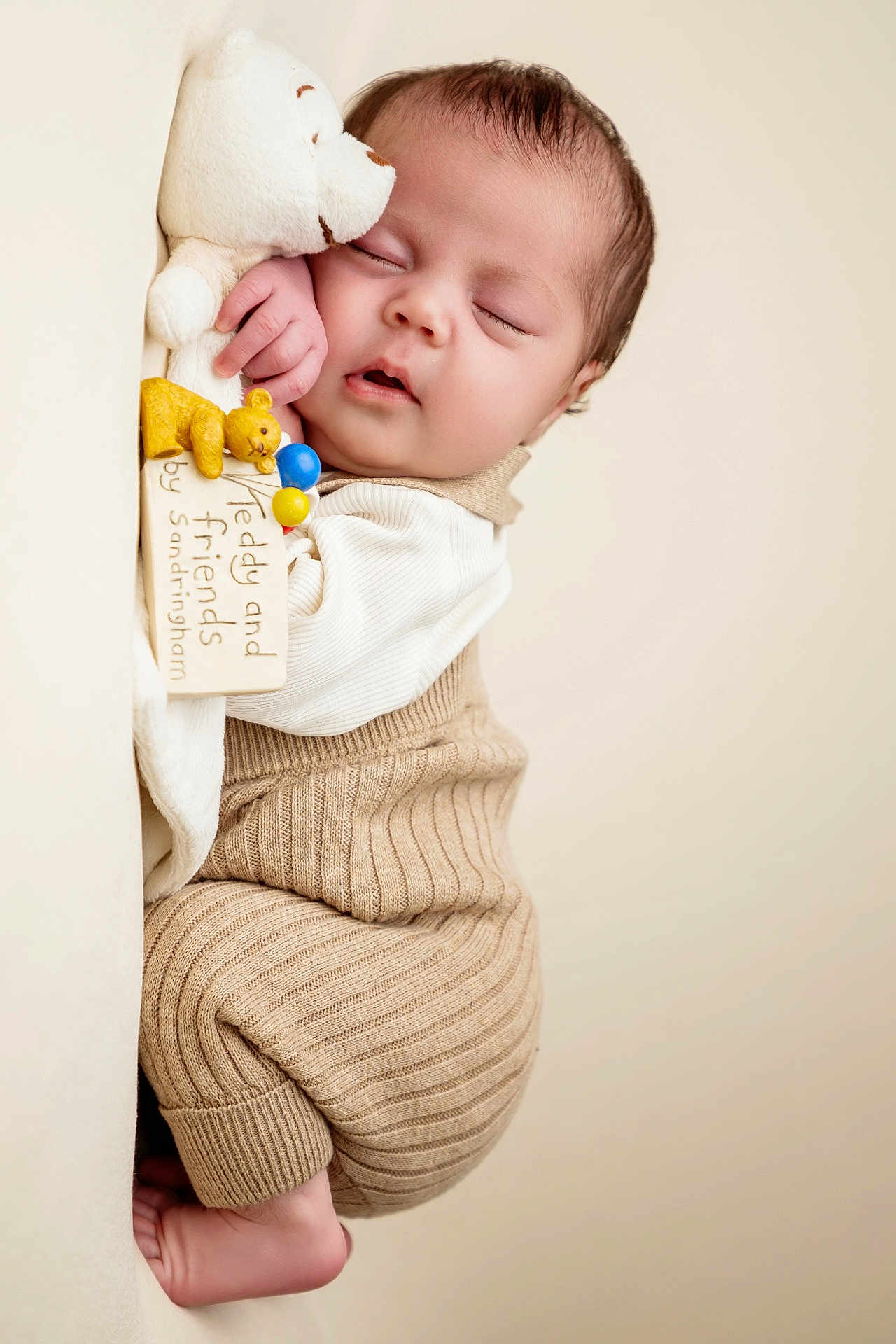 Delilah is registered to the contest to win money with this photo: baby, sleeping, teddy_bear, plush_toy, knitwear, beige, cozy, infant, cute, peaceful, portrait, soft_toy, child, cuddling, close_up, indoors, warm, resting, newborn, adorable
