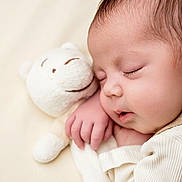Delilah is registered to the contest to win money with this photo: baby, sleeping, teddy_bear, cuddle, soft_toy, infant, close_up, peaceful, cute, child, face, hand, cozy, warm, skin, eyelashes, portrait, rest, comfort, blanket