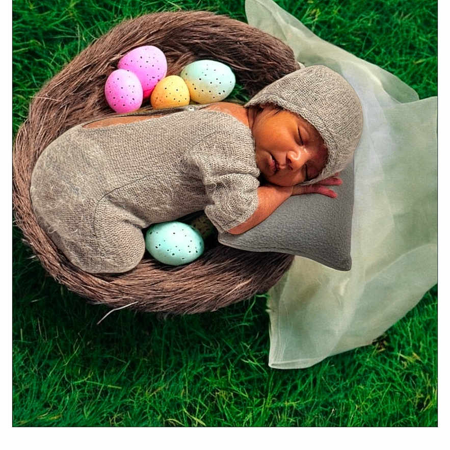 Shivansh is registered to the contest to win money with this photo: baby, child, clothing, egg, face, female, food, girl, glove, grass, hat, head, newborn, person, photography, plant, portrait, purple, sleeping, text
