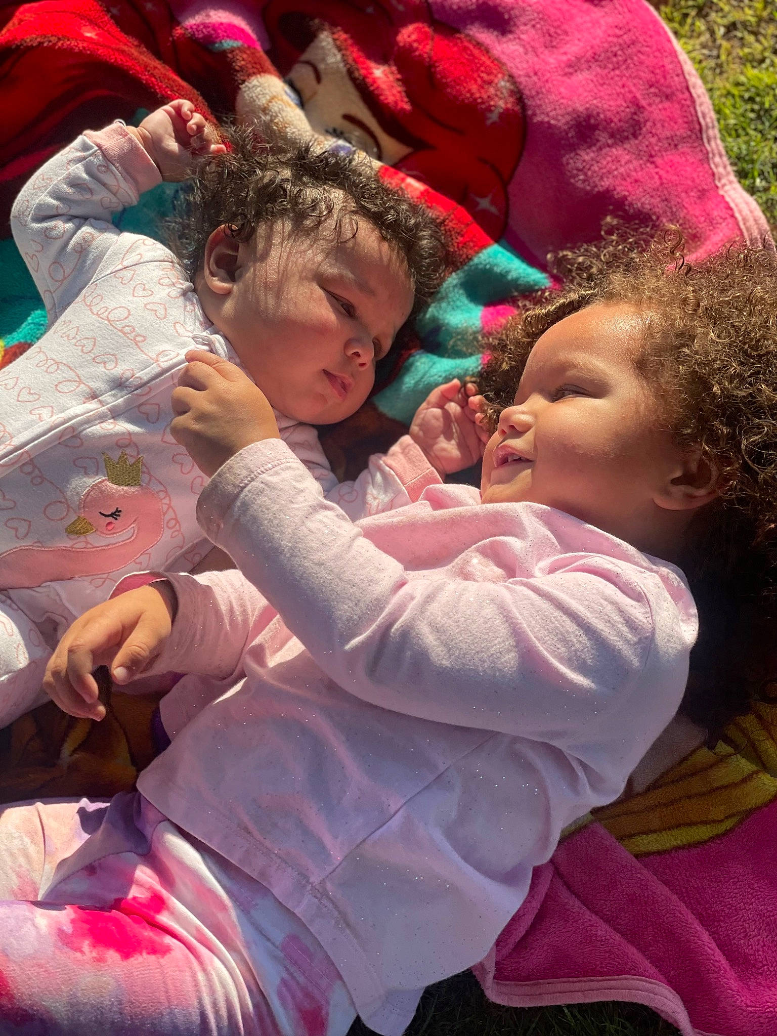 Legacy is registered to the contest to win money with this photo: baby, baby_toddler_clothing, child, event, finger, fun, gesture, grass, hand, happy, lap, leisure, people_in_nature, person, pink, plant, recreation, red, skin, toddler