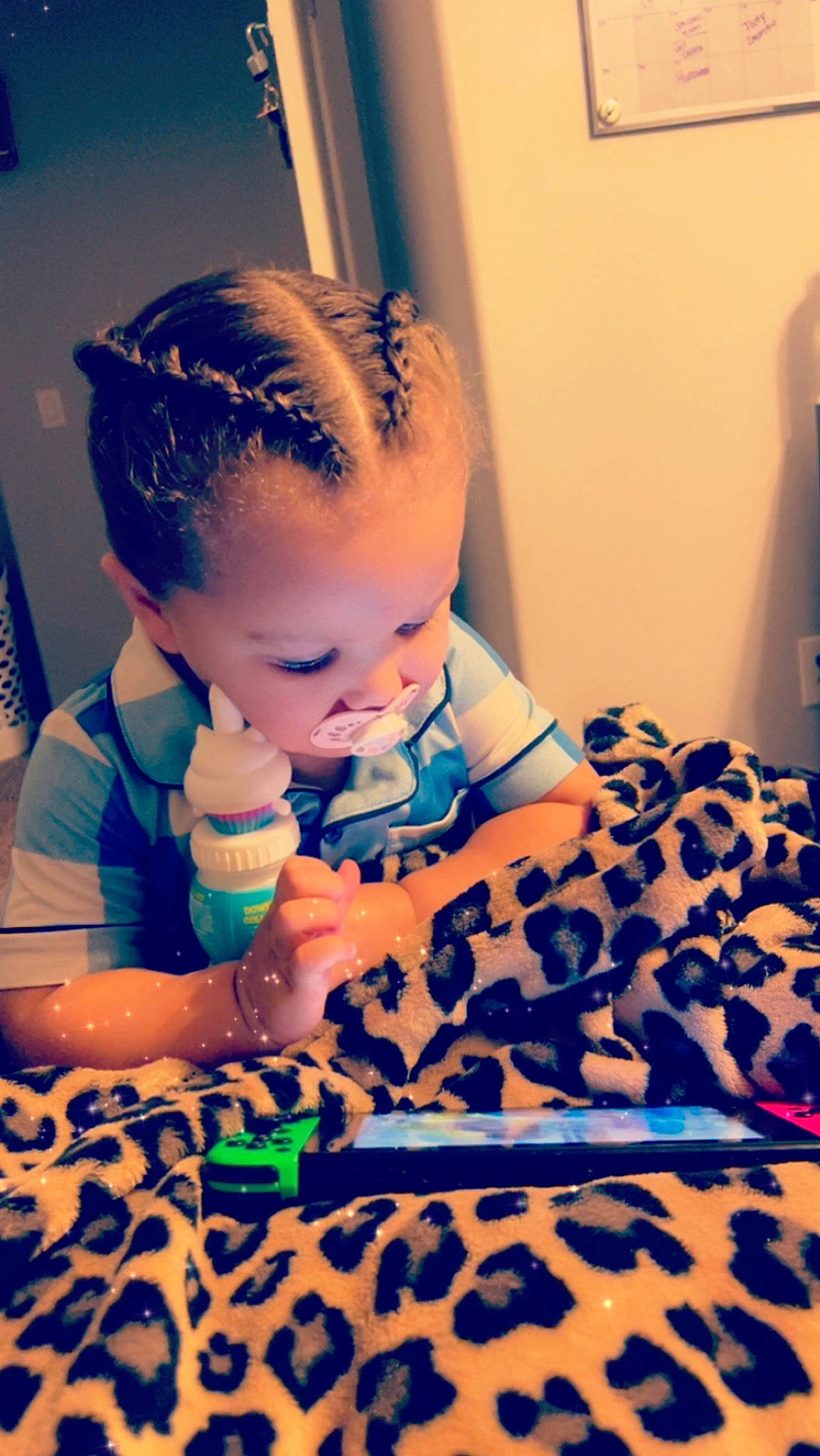 Legacy is registered to the contest to win money with this photo: arm, baby, baby_toddler_clothing, blue, child, comfort, cool, drinkware, electric_blue, flooring, fun, happy, iris, mouth, nail, pattern, person, purple, sitting, skin