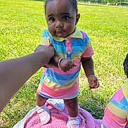 Kali joined the competition — help win amazing prizes! baby, child, outdoor, grass, pink_blanket, colorful_clothing, sneakers, holding_hand, tattoo, tree, sunny_day, person, portrait, cute, smiling, walking, park, playtime, summer, nature