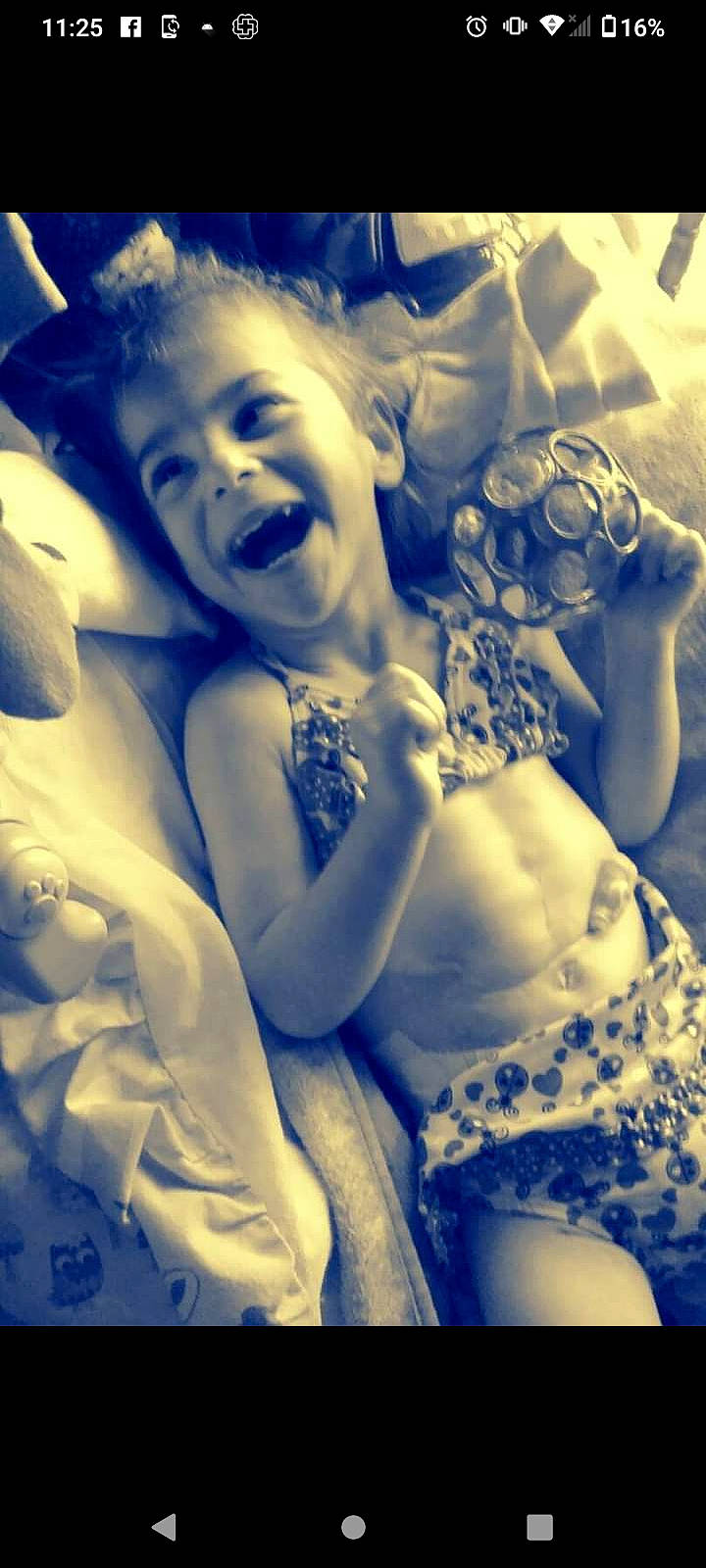 Kaylee is registered to the contest to win money with this photo: angel, arm, beauty, bridal_clothing, child, cloud, dress, finger, flash_photography, fun, gesture, hand, happy, headpiece, monochrome, monochrome_photography, person, petal, smile, toddler