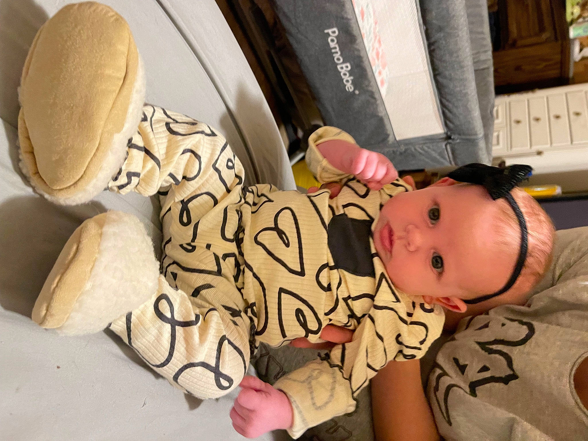 Aubrey is registered to the contest to win money with this photo: automotive_design, baby, baby_products, baby_safety, baby_toddler_clothing, cheek, child, comfort, flooring, foot, hat, human_leg, linens, person, room, sitting, skin, toddler, vehicle_door