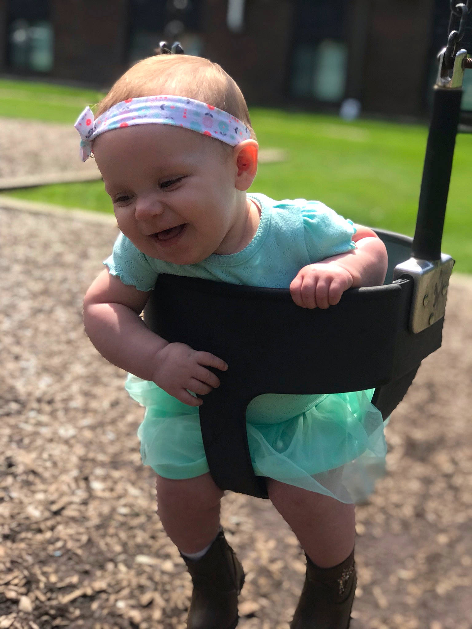 Ashlynn is registered to the contest to win money with this photo: baby, child, fun, headwear, outdoor_play_equipment, person, play, playground, public_space, recreation, shorts, style, t_shirt, toddler, tree, vacation