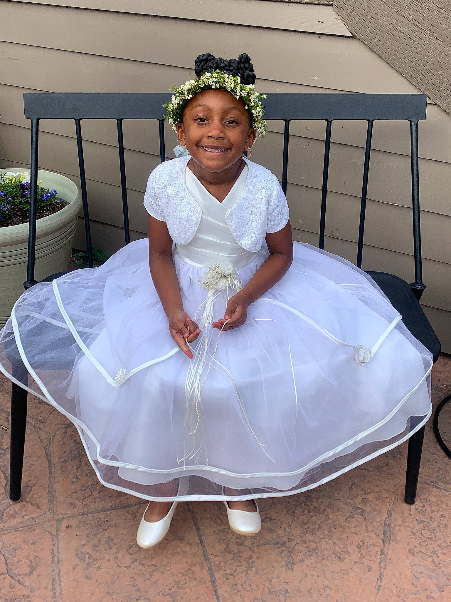 Emery is registered to the contest to win money with this photo: bridal_accessory, bridal_clothing, dress, embellishment, event, fashion_design, flowerpot, formal_wear, gown, hair_accessory, happy, headpiece, headwear, houseplant, jewellery, joy, person, plant, sitting, sleeve