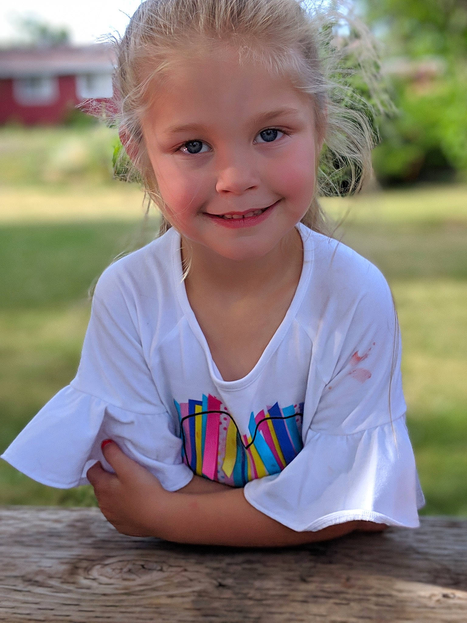 Lillie is registered to the contest to win money with this photo: baby_toddler_clothing, blond, cheek, child, child_model, eye, face, grass, happy, head, joy, lip, person, play, sitting, skin, sleeve, smile, summer, t_shirt