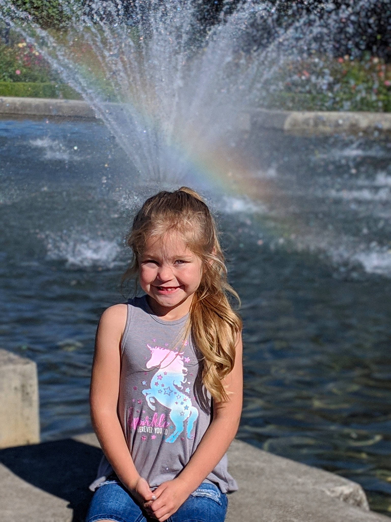 Lillie is registered to the contest to win money with this photo: child, fountain, fun, happy, joy, leisure, person, photography, smile, summer, tree, vacation, water, water_feature