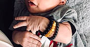 Izaiah joined the competition — help win amazing prizes! accessories, baby, blanket, bodypart, bracelet, clothing, face, happy, head, jewelry, necklace, newborn, person, photography, portrait, quilt, sitting, sleeve, t_shirt, yawning