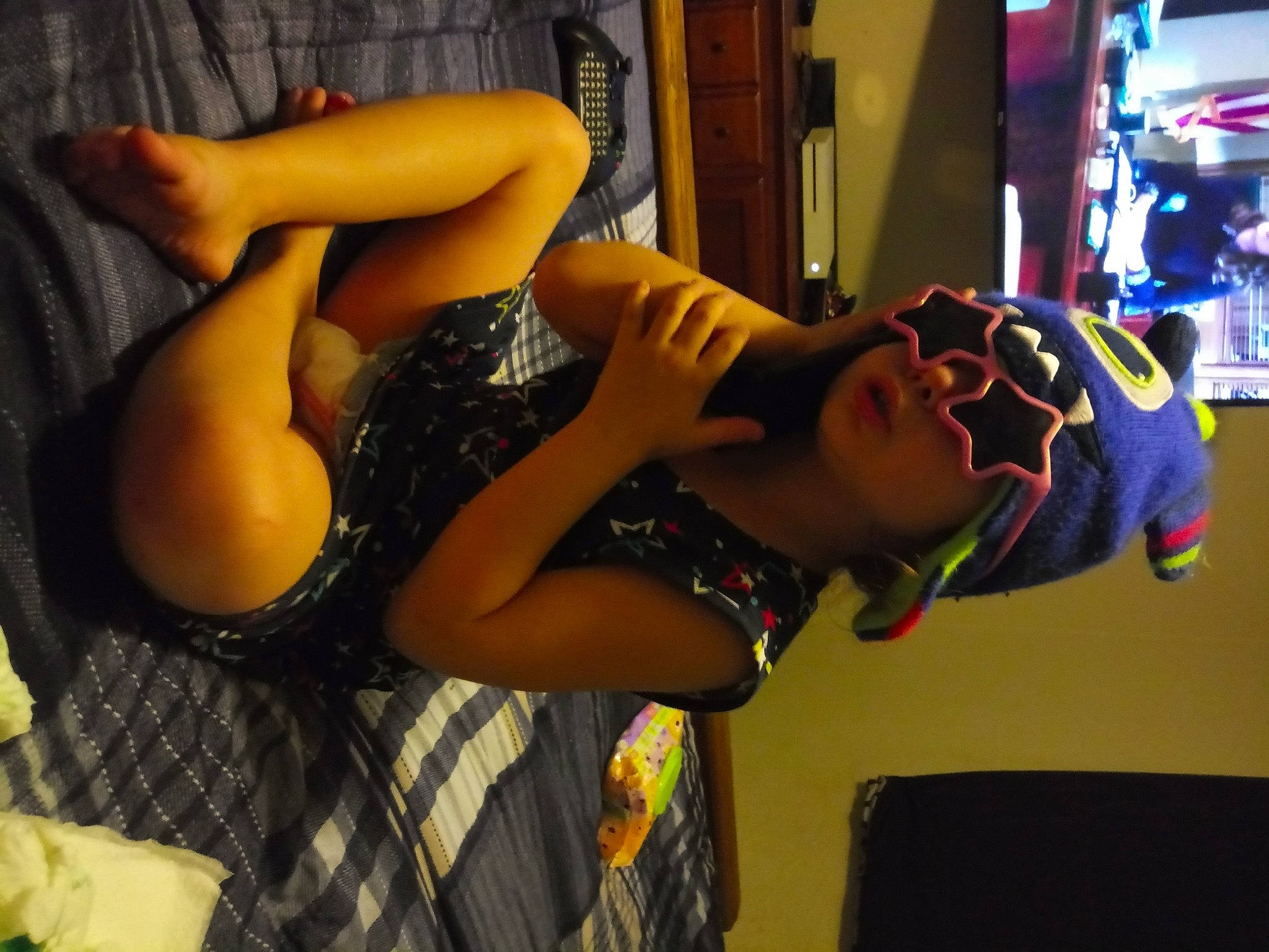 Starla is registered to the contest to win money with this photo: audio_equipment, black_hair, blond, cool, dress, event, eyewear, fashion, fashion_design, flash_photography, fun, hairstyle, headwear, human_body, human_leg, jewellery, person, room, smile, sunglasses