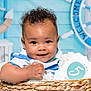 baby, basket, blue, card, child, clock, curly_hair, cute, decor, hand, happy, indoor, infant, nautical, number, person, portrait, ship_wheel, smiling, white