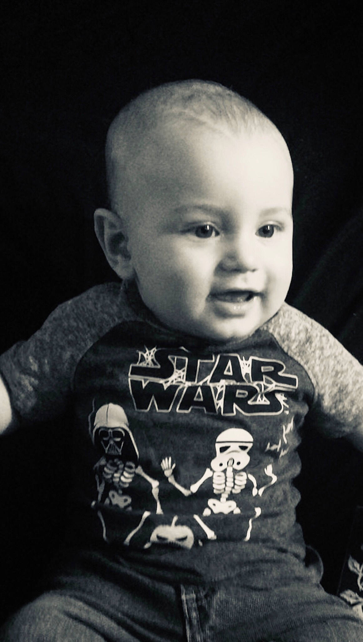 Atreyu is registered to the contest to win money with this photo: baby, black, black_and_white, cheek, child, cool, face, font, forehead, head, monochrome, people, person, photograph, photography, portrait, sleeve, smile, t_shirt, toddler