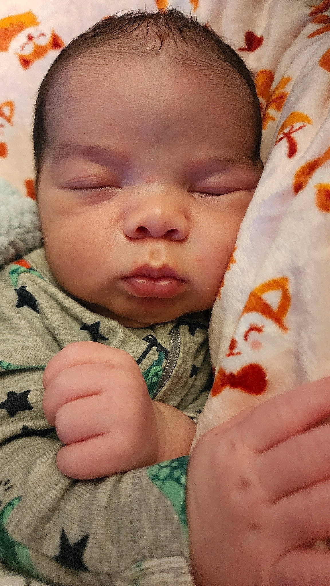 Elijah is registered to the contest to win money with this photo: baby, baby_toddler_clothing, cheek, child, chin, comfort, eye, finger, gesture, happy, head, lip, mammal, mouth, nose, person, skin, sleeve, textile, thumb