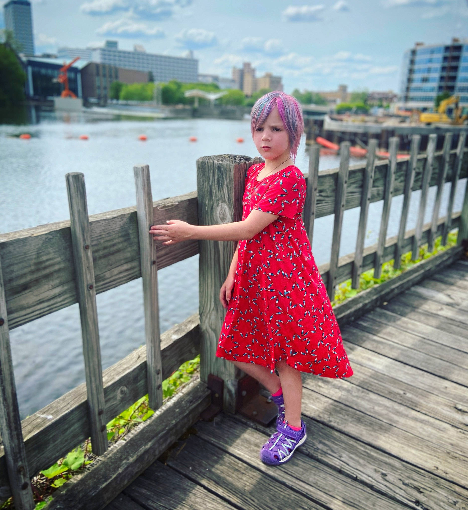 Wyllow is registered to the contest to win money with this photo: bridge, dock, dress, fence, fun, grass, happy, headwear, human_leg, lake, leisure, line, magenta, pattern, person, plant, sky, travel, tree, waist