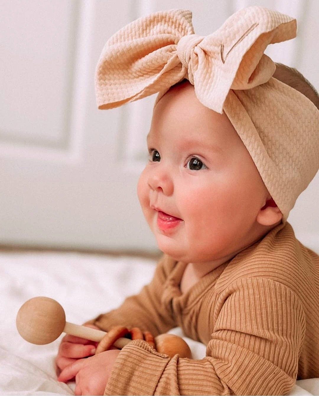 June is registered to the contest to win money with this photo: baby, baby_toddler_clothing, cap, child, comfort, costume_hat, fashion_accessory, happy, hat, headband, headpiece, headwear, peach, person, photograph, product, skin, sleeve, smile, sun_hat