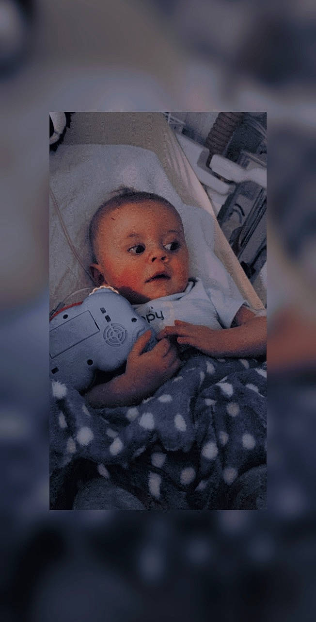 Tyler participe au concours pour gagner de l'argent avec cette photo : art, baby, baby_toddler_clothing, child, comfort, flash_photography, fun, grey, iris, linens, pattern, person, photographic_paper, portrait, portrait_photography, room, sitting, sleeve, textile, toddler