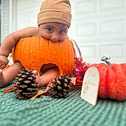 Zane joined the competition — help win amazing prizes! baby, pumpkin, hat, autumn, pinecones, leaves, orange, cute, playful, blanket, outdoor, fall, child, decor, foot, hand, garage, seasonal, holiday, smiling