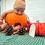 baby, pumpkin, hat, autumn, pinecones, leaves, orange, cute, playful, blanket, outdoor, fall, child, decor, foot, hand, garage, seasonal, holiday, smiling