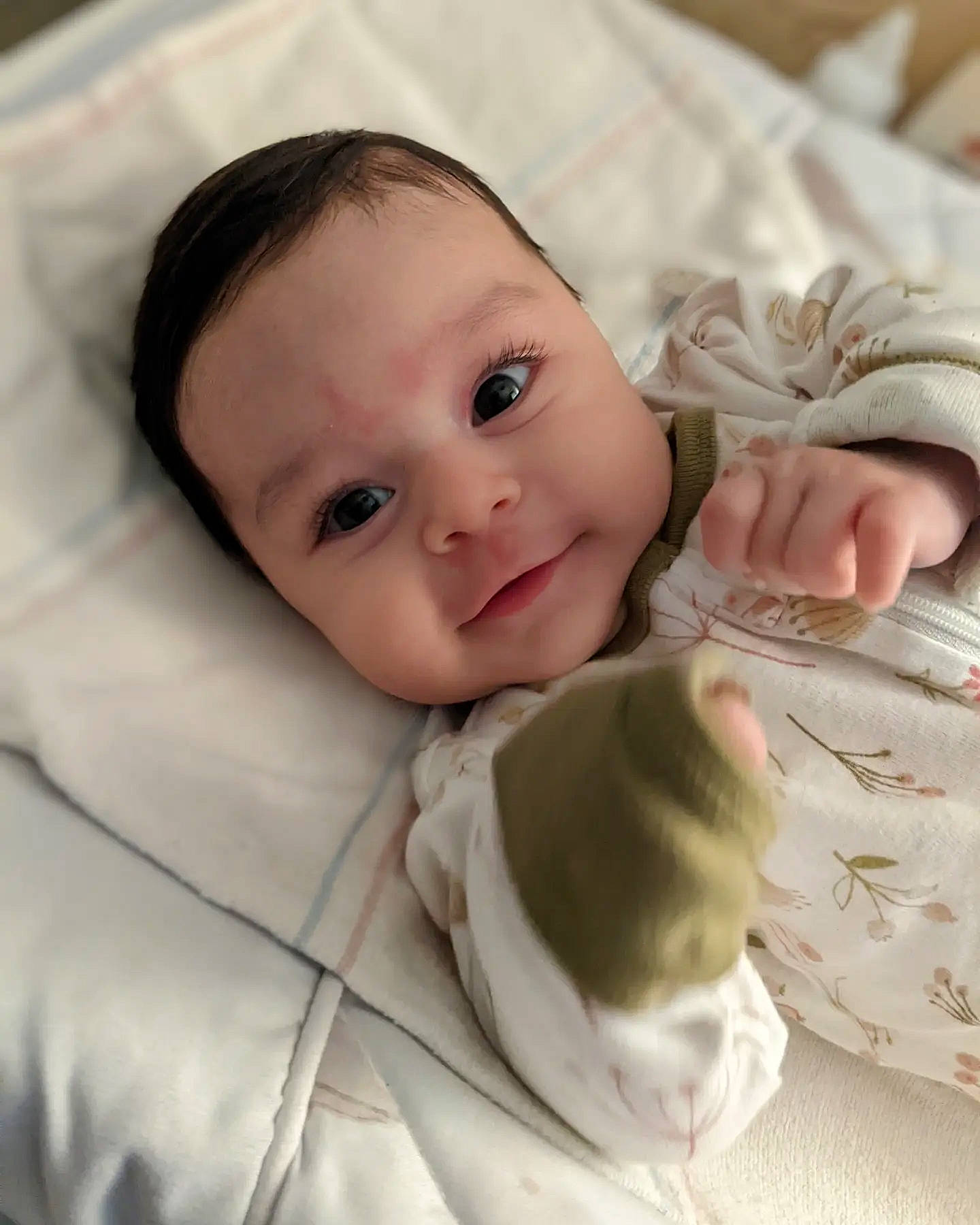 Leila is registered to the contest to win money with this photo: baby, baby_toddler_clothing, beauty, cheek, child, collar, comfort, gesture, happy, iris, linens, lip, mammal, outerwear, pattern, person, skin, sleeve, smile, textile