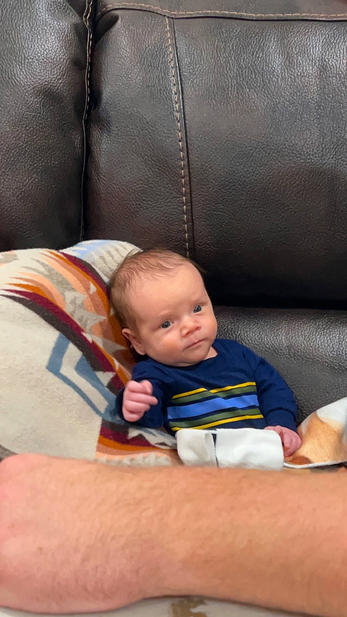 Axton is registered to the contest to win money with this photo: baby, baby_products, baby_toddler_clothing, chair, child, comfort, couch, flooring, foot, grass, human_leg, knee, lap, leisure, linens, person, room, sitting, t_shirt, toddler