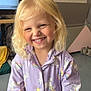 Méloa a rejoint le concours — aidez-le/la à gagner de superbes lots ! child, smiling, blonde_hair, curly_hair, onesie, unicorn_pattern, indoor, toy, happy, portrait, casual, cozy, playful, pajamas, young_child, cute, person, face, colorful, fun