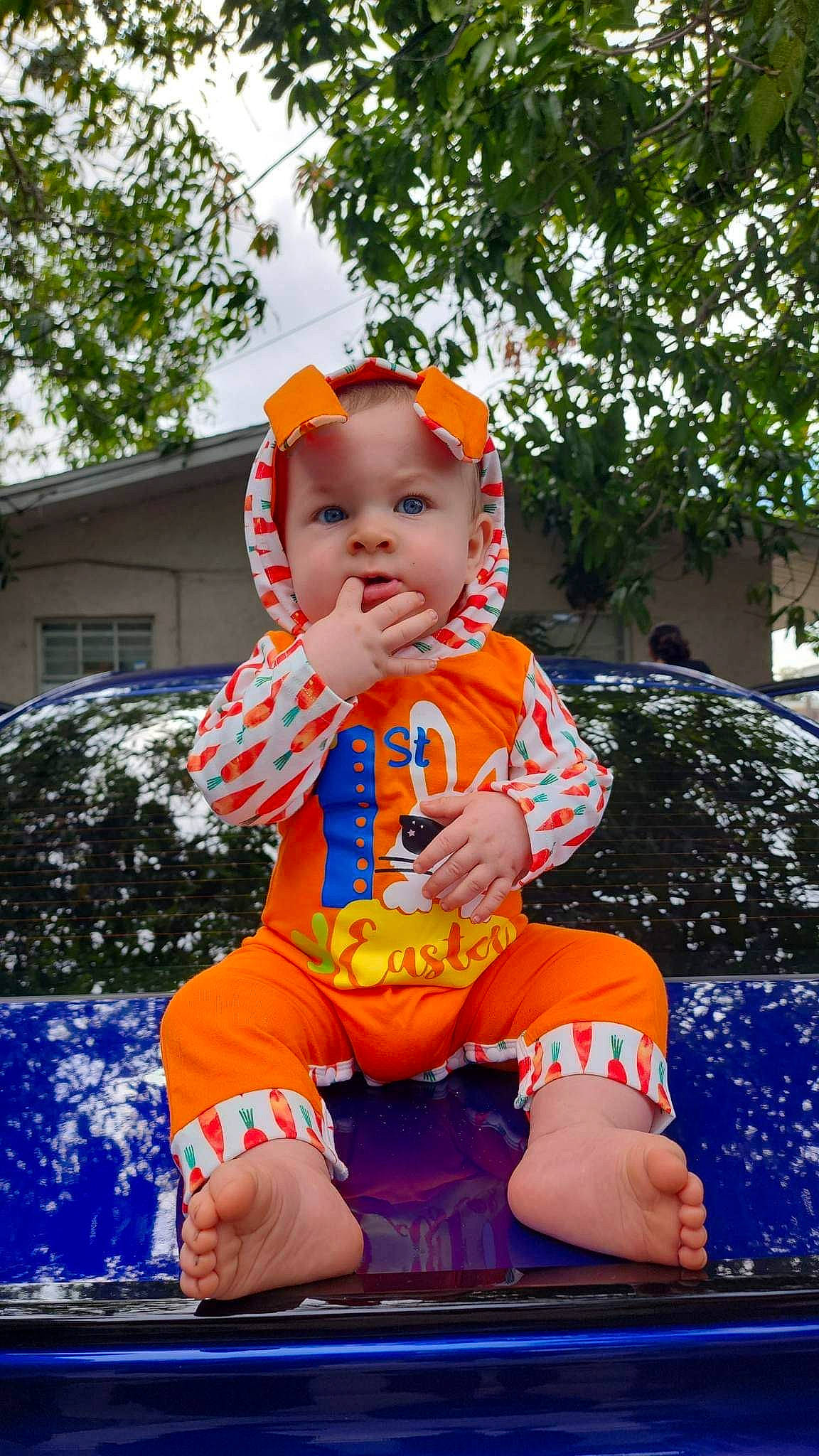Chance is registered to the contest to win money with this photo: baby, baby_toddler_clothing, car, child, electric_blue, fun, grass, happy, hat, headwear, leisure, orange, person, personal_protective_equipment, plant, recreation, shorts, sitting, t_shirt, toddler