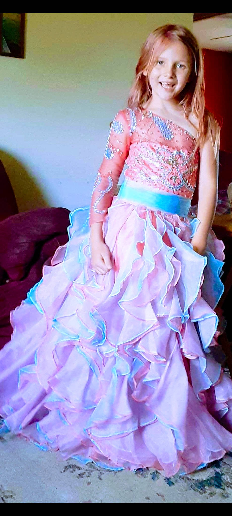 Cheyenne is registered to the contest to win money with this photo: aqua, arm, day_dress, electric_blue, embellishment, entertainment, fashion_design, formal_wear, gown, joy, magenta, one_piece_garment, person, pink, purple, ruffle, shoulder, sleeve, smile, textile