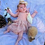 Evrleigh joined the competition — help win amazing prizes! baby, infant, newborn, dress, bow_headband, blanket, rabbit, bunny, chick, bird, pinecone, grass, outdoors, picnic_blanket, cute, portrait, pink, tulle, lying_down, tiny_feet