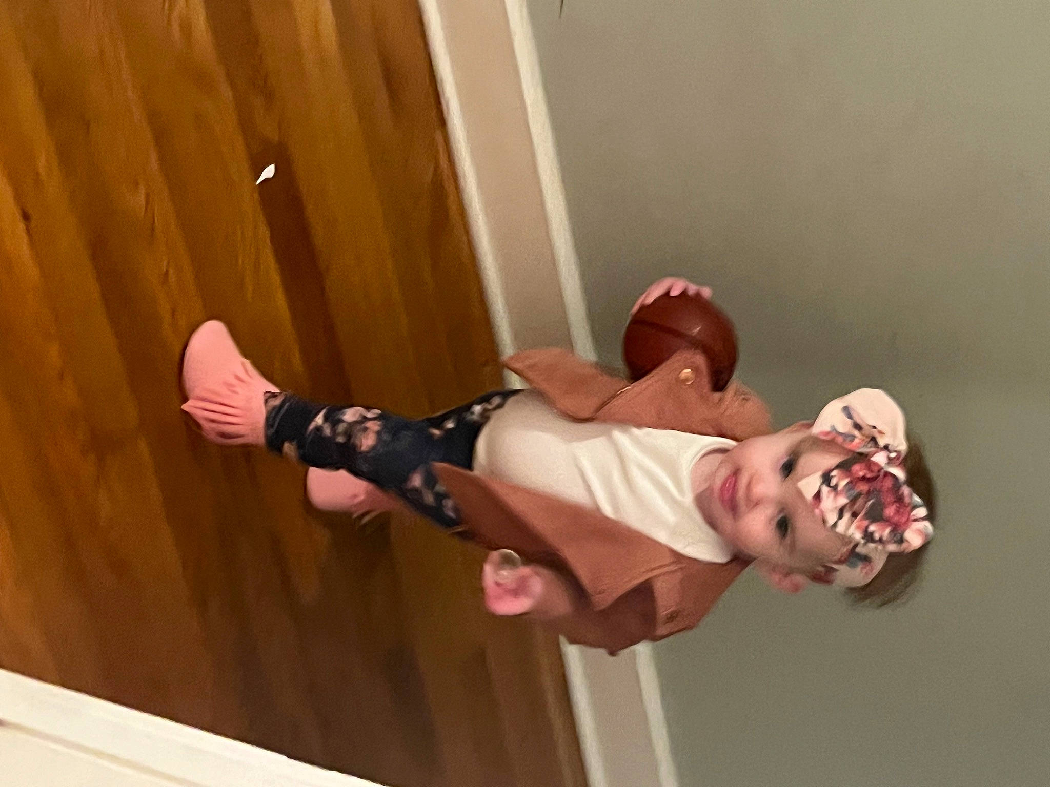 Brooklyn is registered to the contest to win money with this photo: ceiling, child, elbow, event, flooring, fun, happy, hardwood, headwear, human_leg, knee, peach, performing_arts, person, room, sock, stairs, thigh, walking_shoe, wood