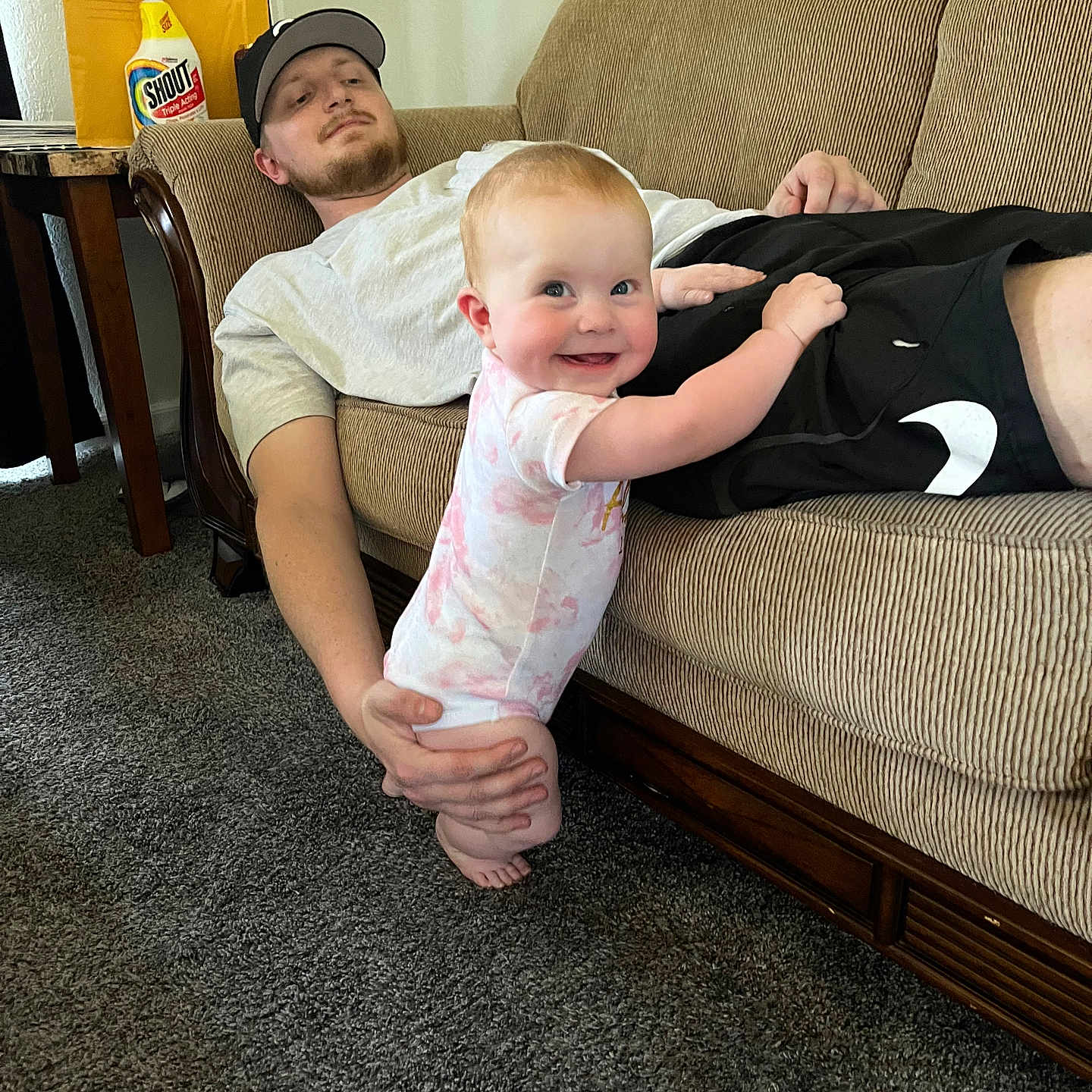 Everleigh is registered to the contest to win money with this photo: architecture, baby, building, clothing, couch, cushion, face, furniture, head, homedecor, indoors, interiordesign, livingroom, pants, people, person, photography, portrait, room, t_shirt