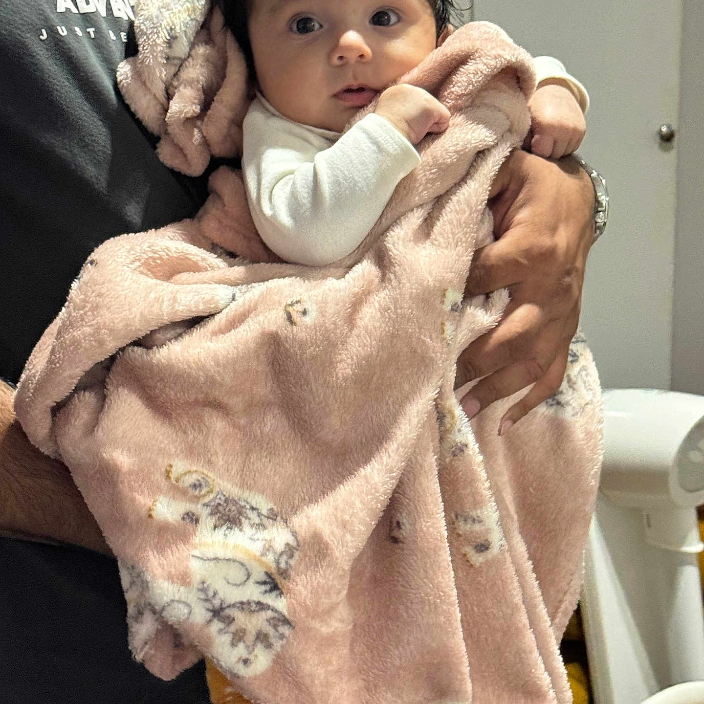 Zara joined the competition — help win amazing prizes! adult, animal_print, baby, blanket, child, clothing, curious, cute, family, hands, holding, indoor, infant, newborn, person, pink_blanket, portrait, soft_texture, warm, wide_eyes