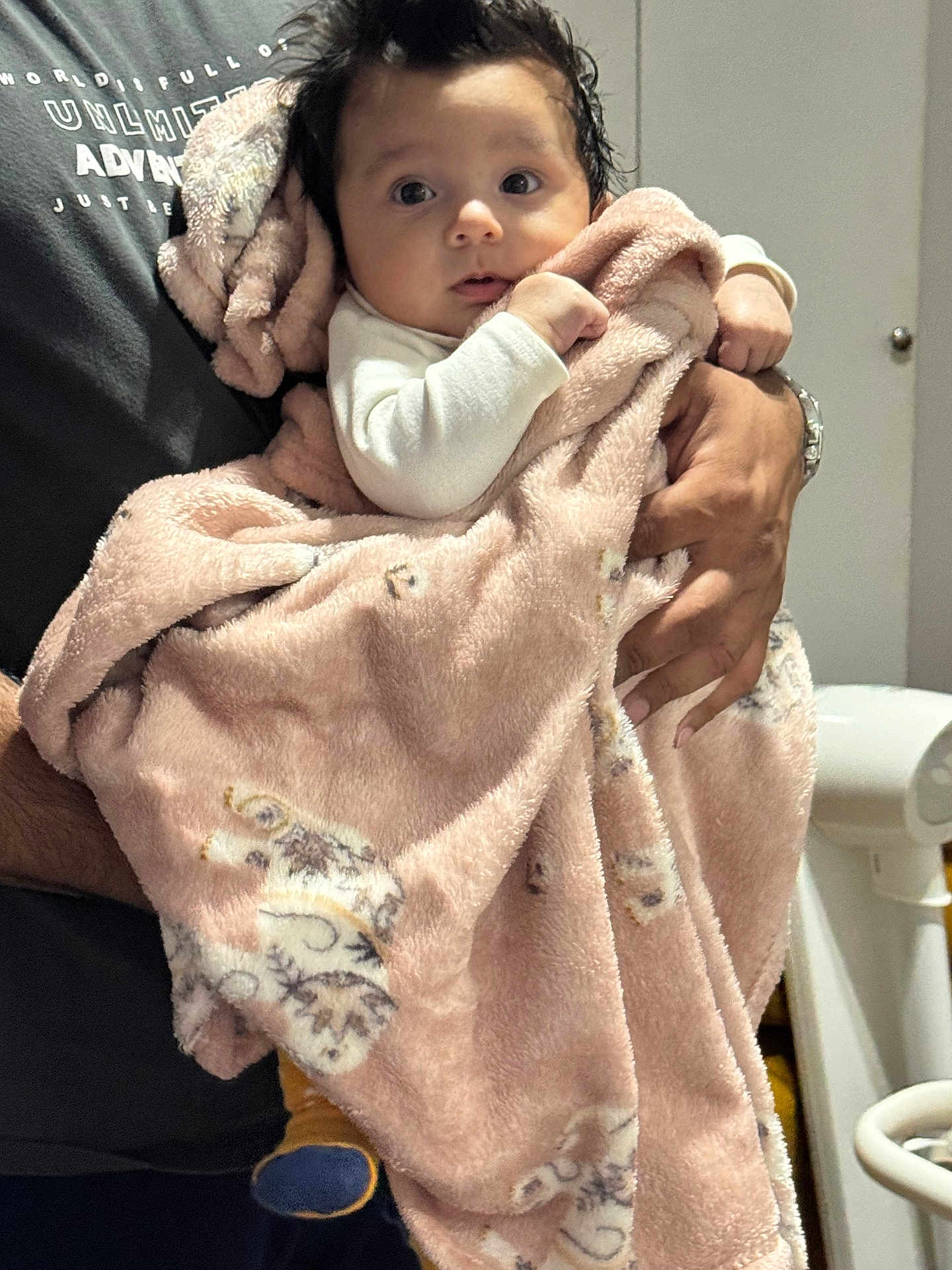 Zara joined the competition — help win amazing prizes! baby, child, blanket, pink_blanket, animal_print, infant, person, holding, hands, curious, wide_eyes, indoor, soft_texture, warm, clothing, adult, portrait, cute, newborn, family