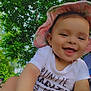 Victoria is registered to the contest to win money with this photo: baby, child, smiling, happy, outdoor, greenery, trees, hat, sunhat, onesie, cute, face, skin, hand, nature, daylight, portrait, person, infant, babyclothes
