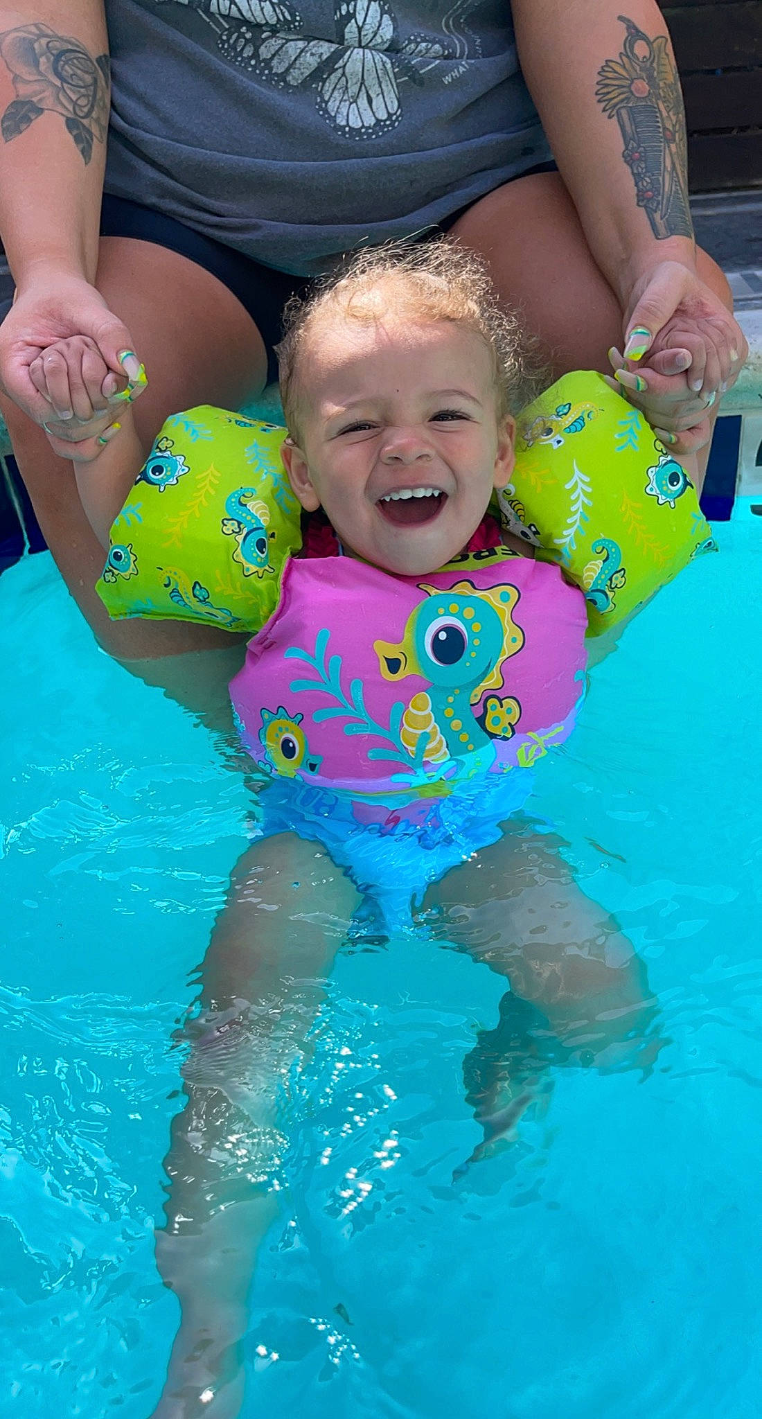 Kamiya is registered to the contest to win money with this photo: aqua, azure, baby, baby_toddler_clothing, blue, fun, green, happy, head, leisure, people, person, personal_protective_equipment, photograph, pink, product, smile, summer, swimming_pool, toddler