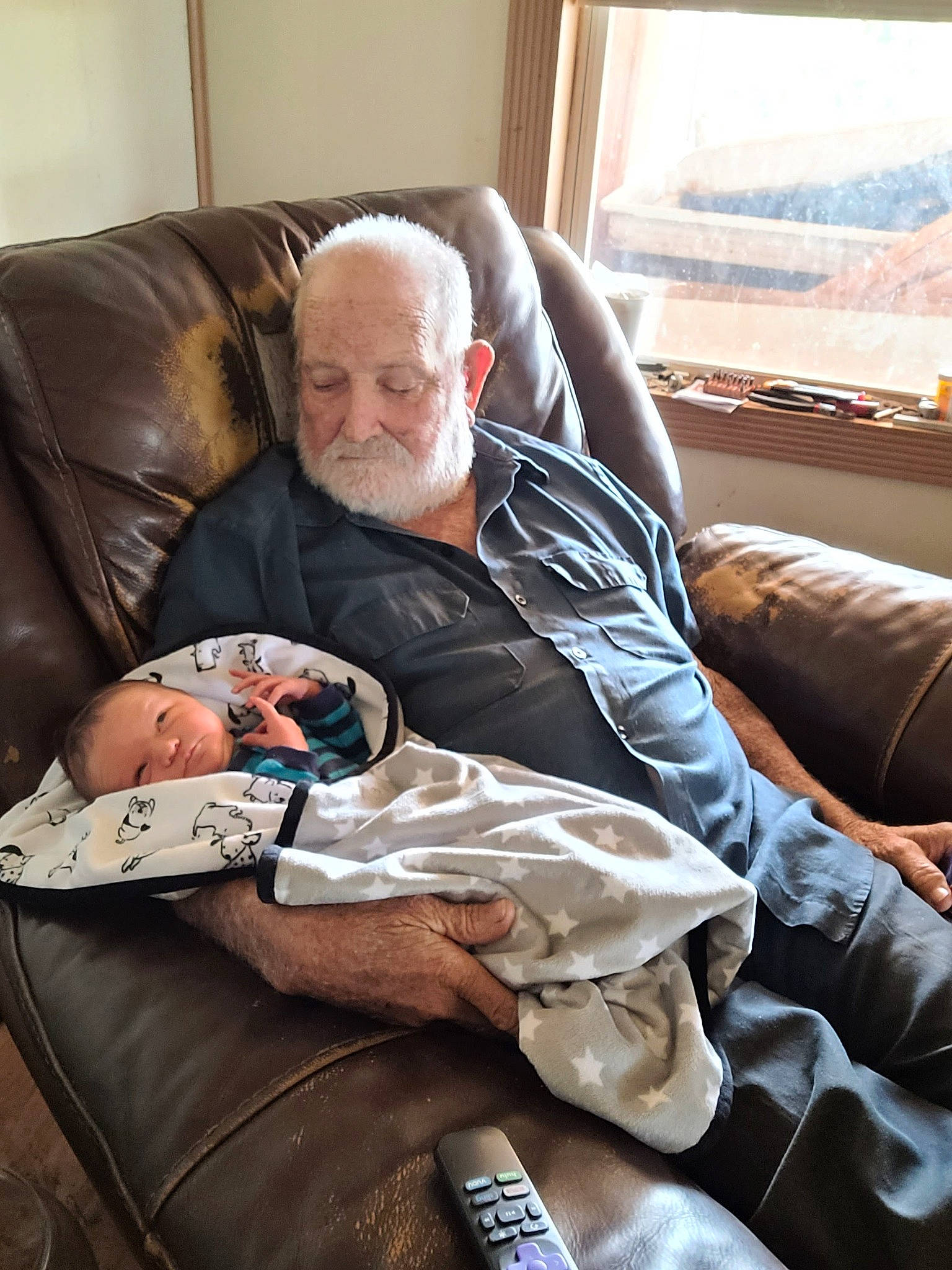 Ryder-gene is registered to the contest to win money with this photo: baby, child, comfort, couch, curtain, eyewear, glasses, human, lap, leg, living_room, nap, people, person, reading, room, sitting, sunglasses, toddler, vacation