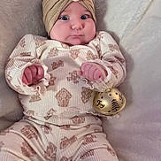 Rosemary joined the competition — help win amazing prizes! baby, bell, blanket, child, clothing, cozy, cute, expression, flower, hand, headband, indoors, infant, lying_down, pajamas, pattern, person, portrait, soft, wide_eyes