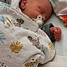 Tiago participe au concours pour gagner de l'argent avec cette photo : newborn, baby, sleeping, blanket, pacifier, bed, pillow, animal_print, cozy, infant, cute, peaceful, wrapped, soft, child, indoors, resting, clothing, headwear, hand