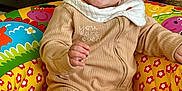 George joined the competition — help win amazing prizes! baby, child, smiling, onesie, colorful, play_ring, indoor, cute, happy, face, person, cozy, decor, basket, toy, clothing, infant, home, sitting, portrait