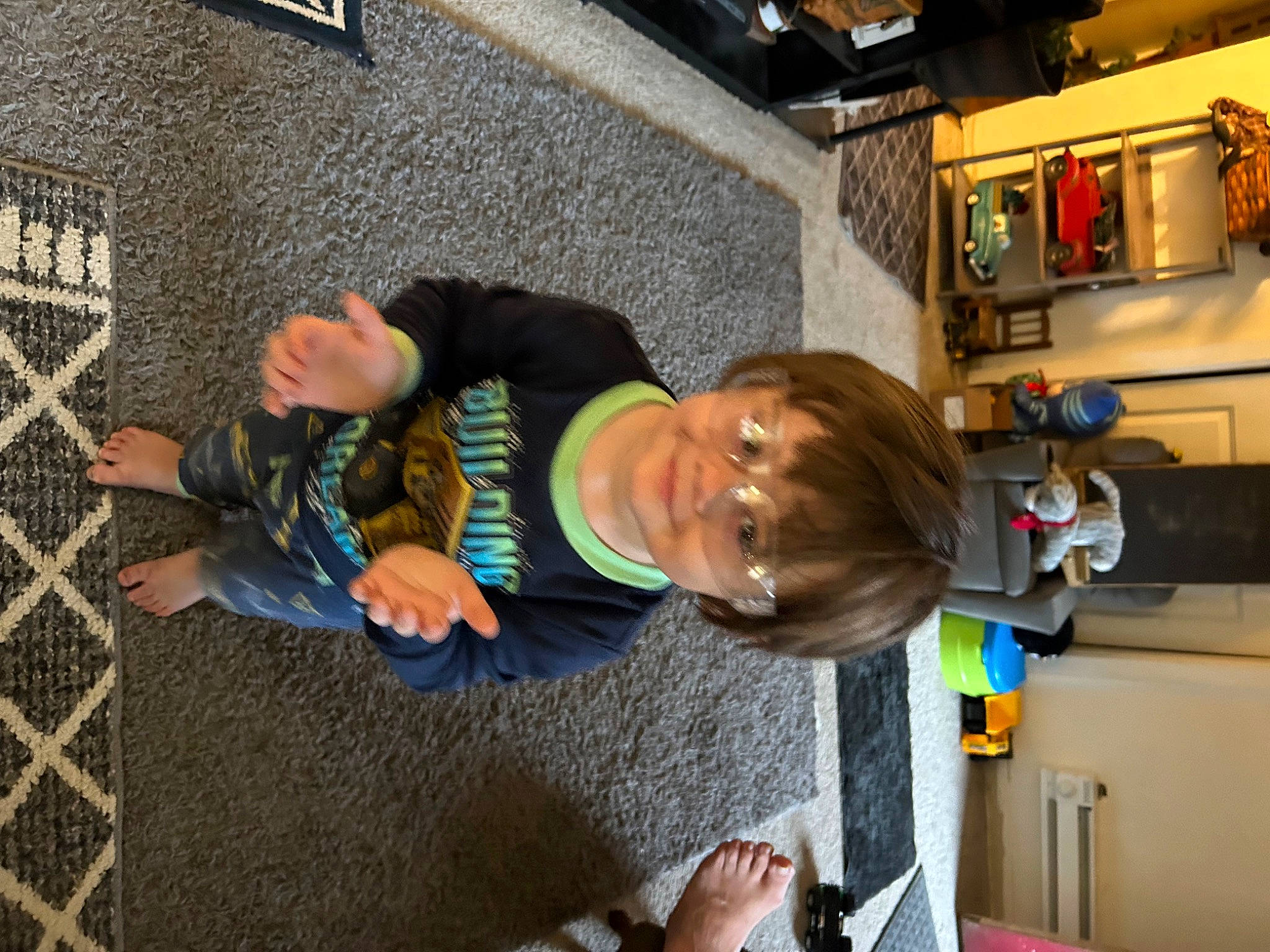 Brantley is registered to the contest to win money with this photo: asphalt, child, flooring, fun, joy, machine, person, road_surface, room, sidewalk, t_shirt, tire, toddler