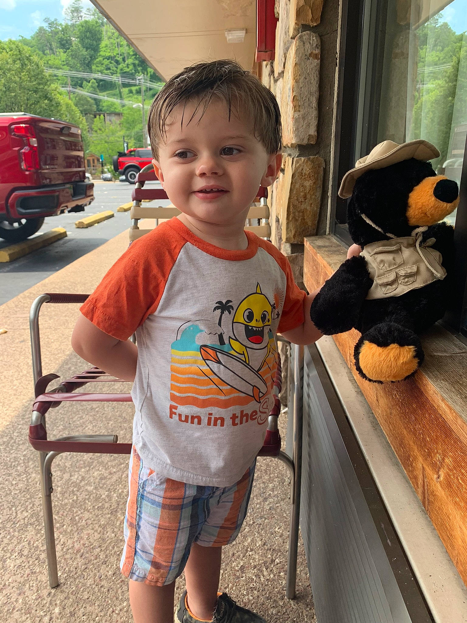 Brantley is registered to the contest to win money with this photo: child, fun, hairstyle, happy, joy, leisure, people, person, shorts, skin, smile, standing, t_shirt, temple, tire, toddler, tourism, toy, travel, tree