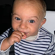 Lyvio participe au concours pour gagner de l'argent avec cette photo : toddler, child, blue_eyes, striped_shirt, high_chair, eating, hand, face, smile, indoor, person, baby, seatbelt, curly_hair, snack, cute, closeup, portrait, happy, skin