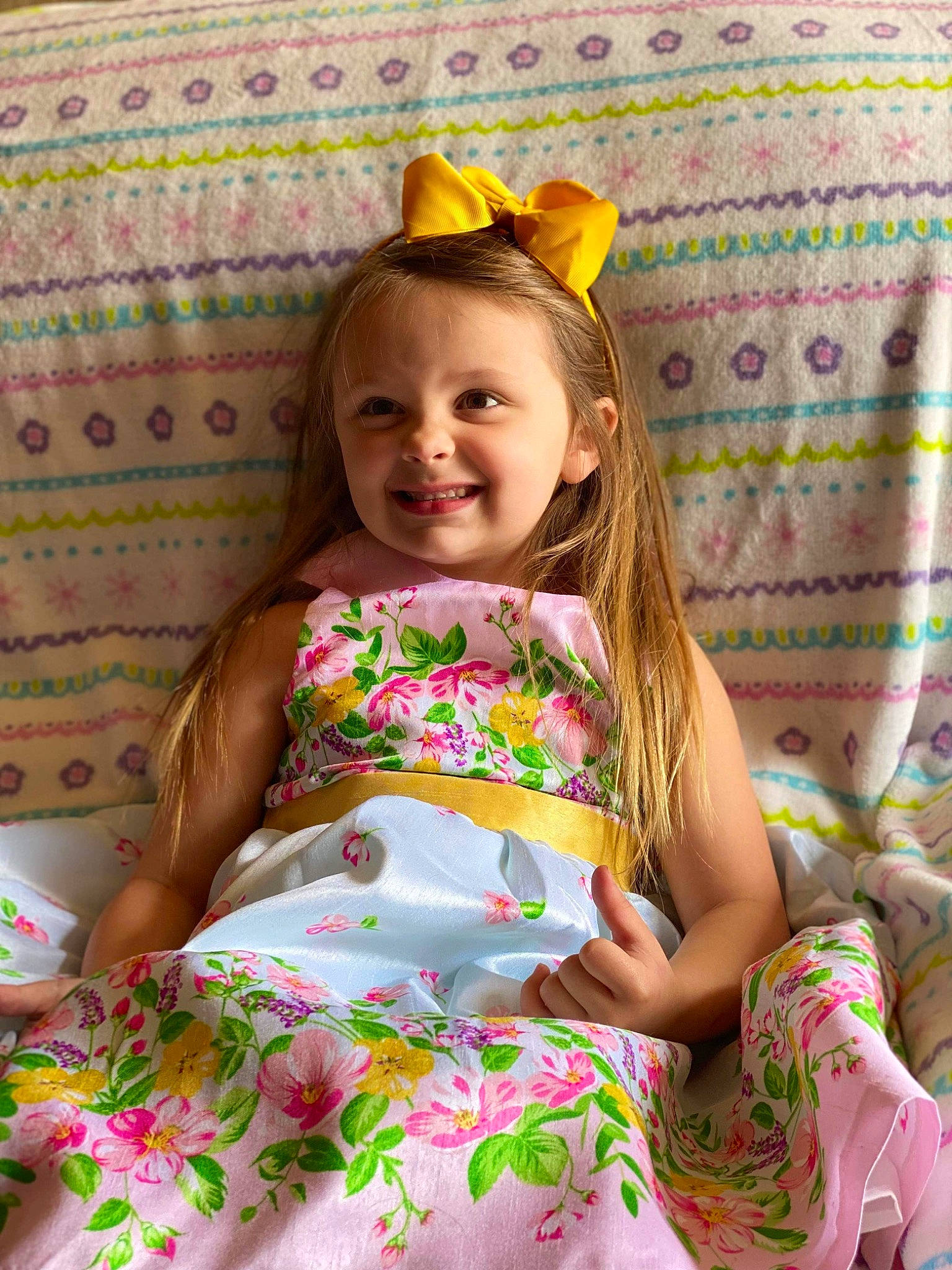 Kaylene is registered to the contest to win money with this photo: baby_toddler_clothing, beauty, day_dress, dress, event, eye, face, fun, green, happy, joy, long_hair, magenta, pattern, person, pink, sitting, skin, smile, textile