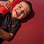 Miliano joined the competition — help win amazing prizes! child, toddler, smiling, happy, plush_toy, cushion, indoor, portrait, casual_clothing, short_hair, bright_colors, playful, cute, closeup, young_child, person, toy, relaxed, cheerful, resting