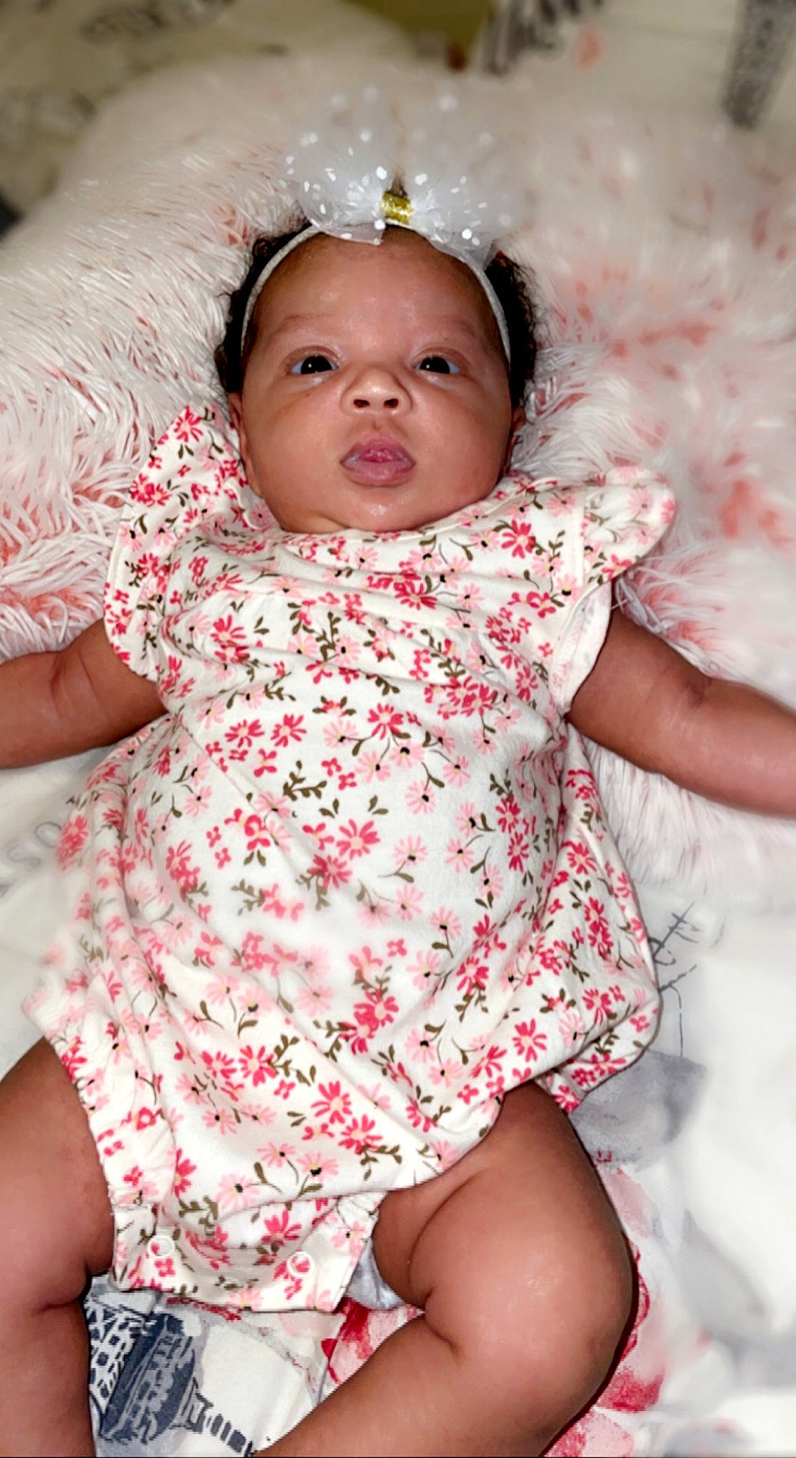 Des'Mariah is registered to the contest to win money with this photo: arm, baby_toddler_clothing, cheek, chin, dress, eye, eyebrow, face, facial_expression, hair, hand, head, human, lip, mouth, nose, organ, person, photograph, skin