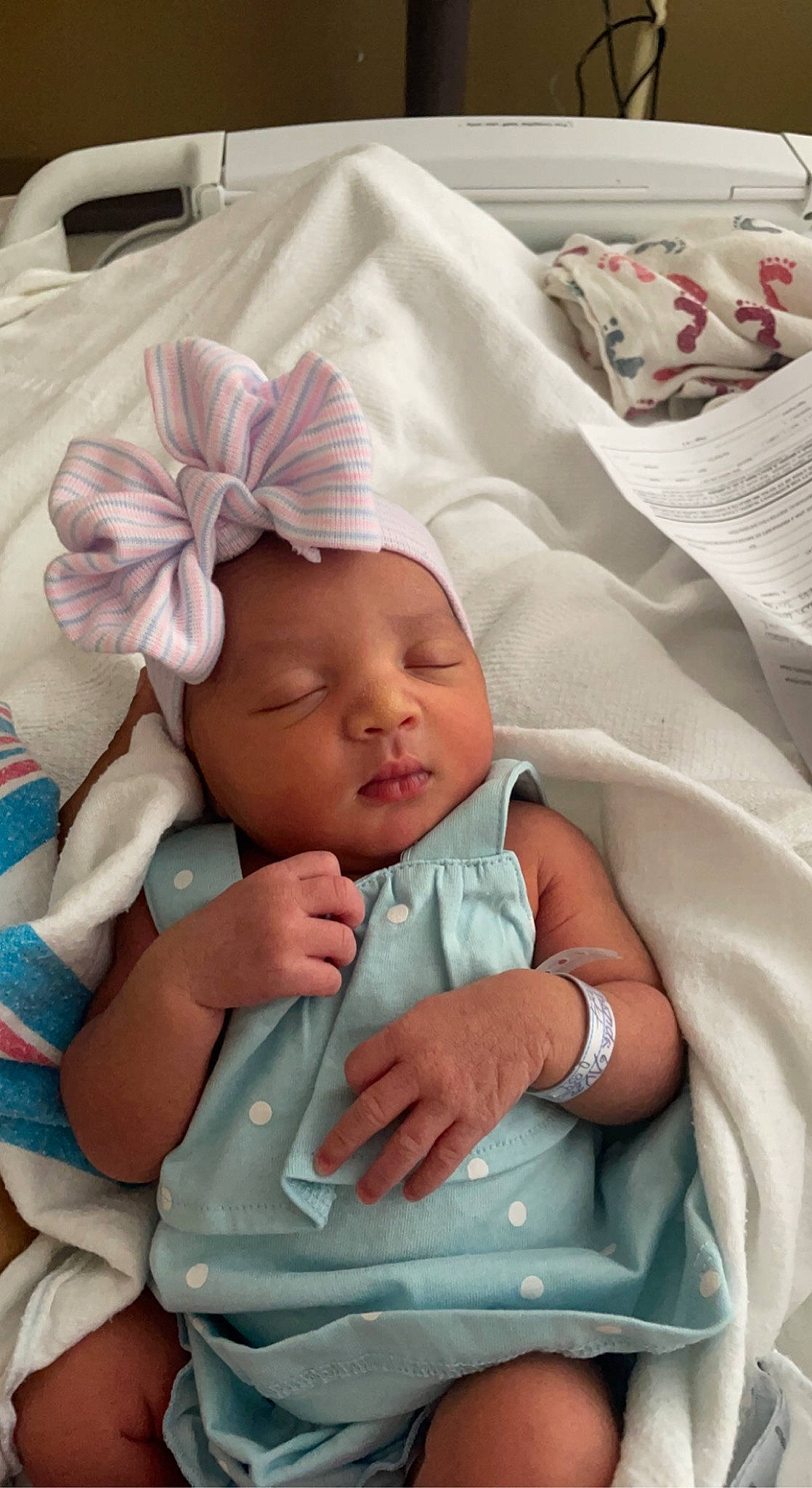 Des'Mariah joined the competition — help win amazing prizes! baby, baby_products, baby_safety, baby_sleeping, baby_toddler_clothing, child, comfort, fashion_accessory, finger, hand, headwear, linens, nail, pattern, person, sitting, skin, textile, thumb, toddler